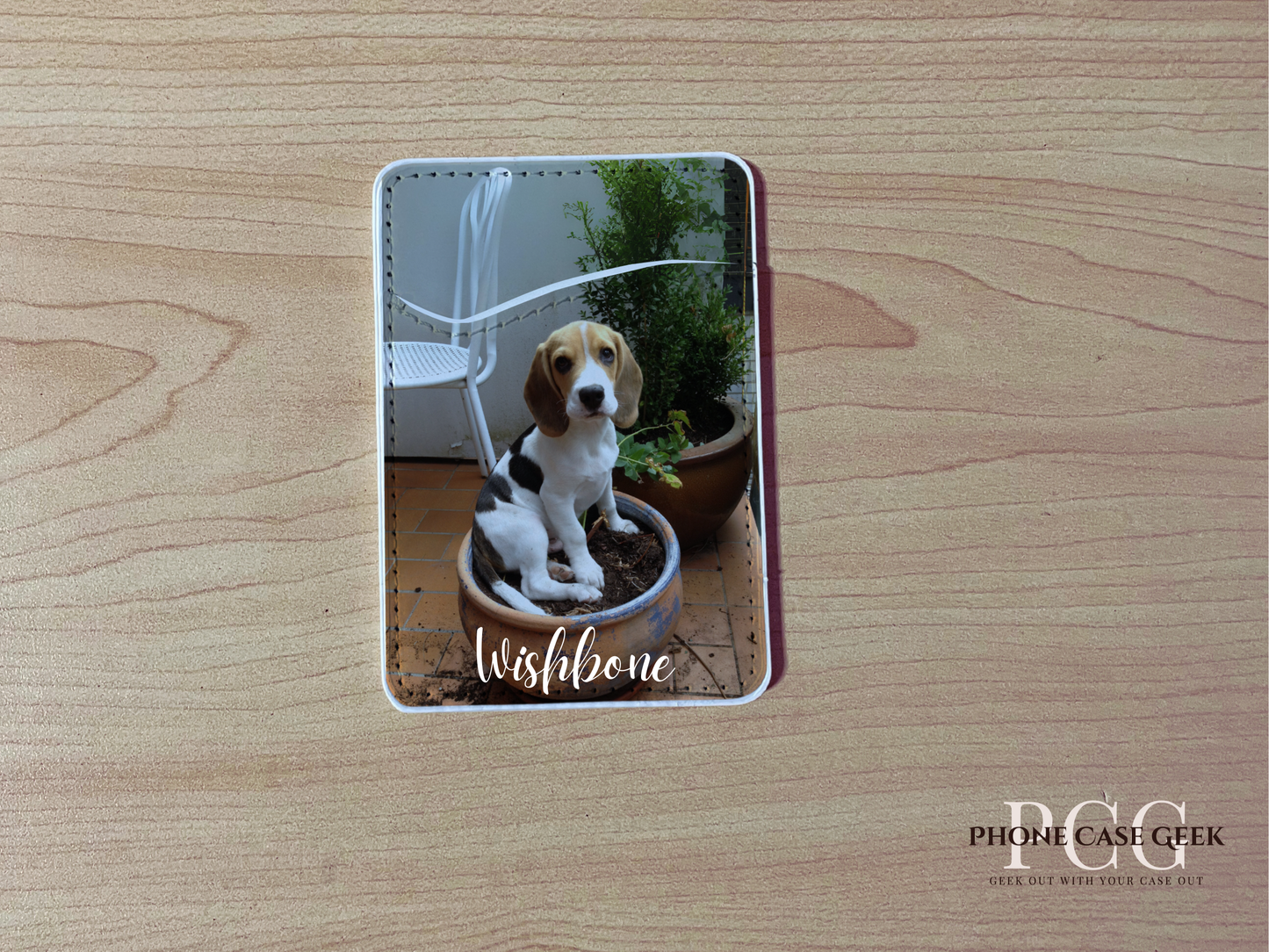Custom adhesive phone wallet/card holder with a picture of a dog with "Wishbone" text on a wooden surface.