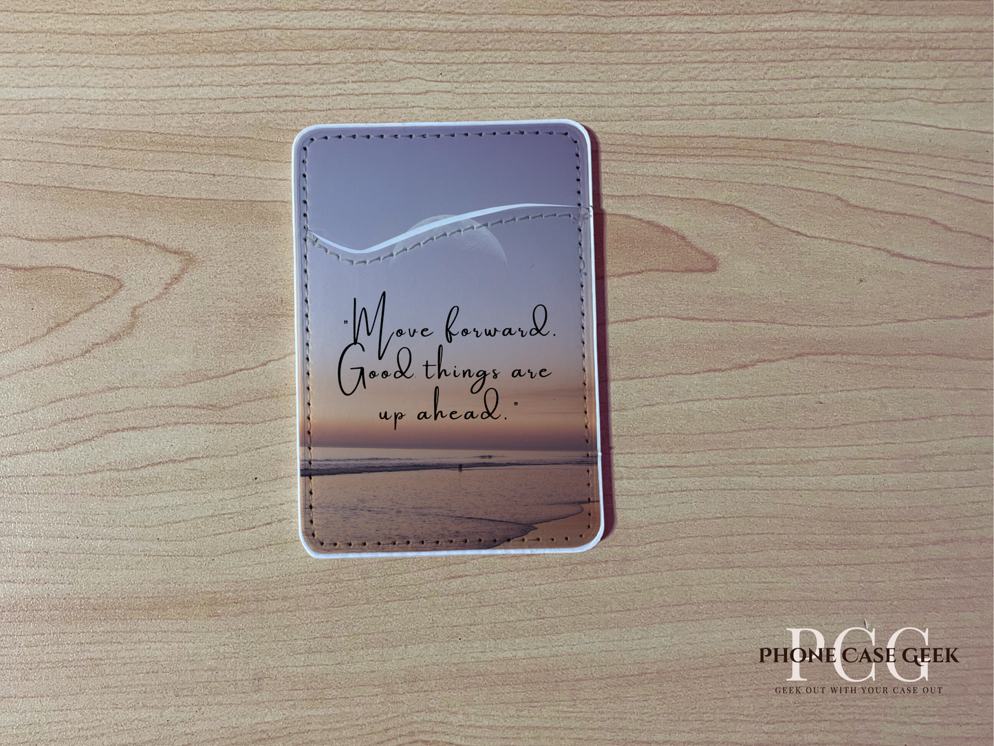 Custom phone wallet/card holder with beach image with quote design "Move forward good things are up ahead" text on a wooden surface.