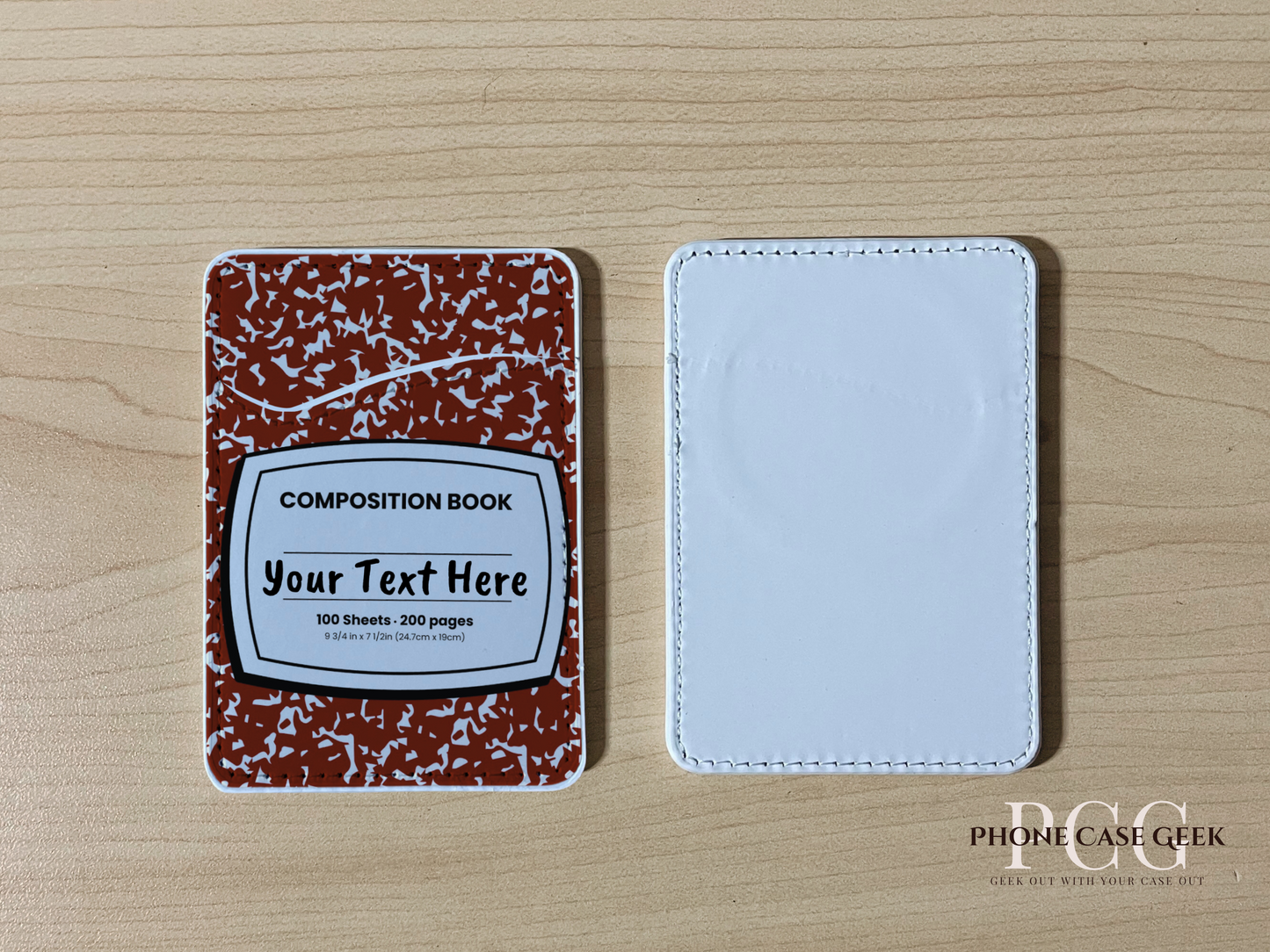 Custom magsafe phone wallet/card holder with red and white composition notebook design on a wooden surface.