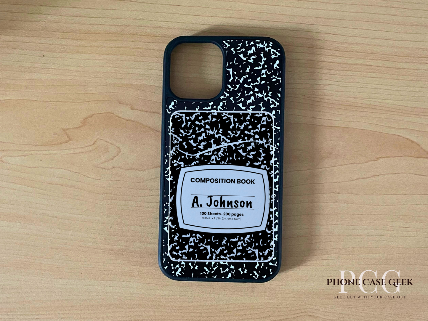 Custom phone case with black and white composition notebook design with matching adhesive phone wallet/card holder with text "A. Johnson" text on a wooden surface.