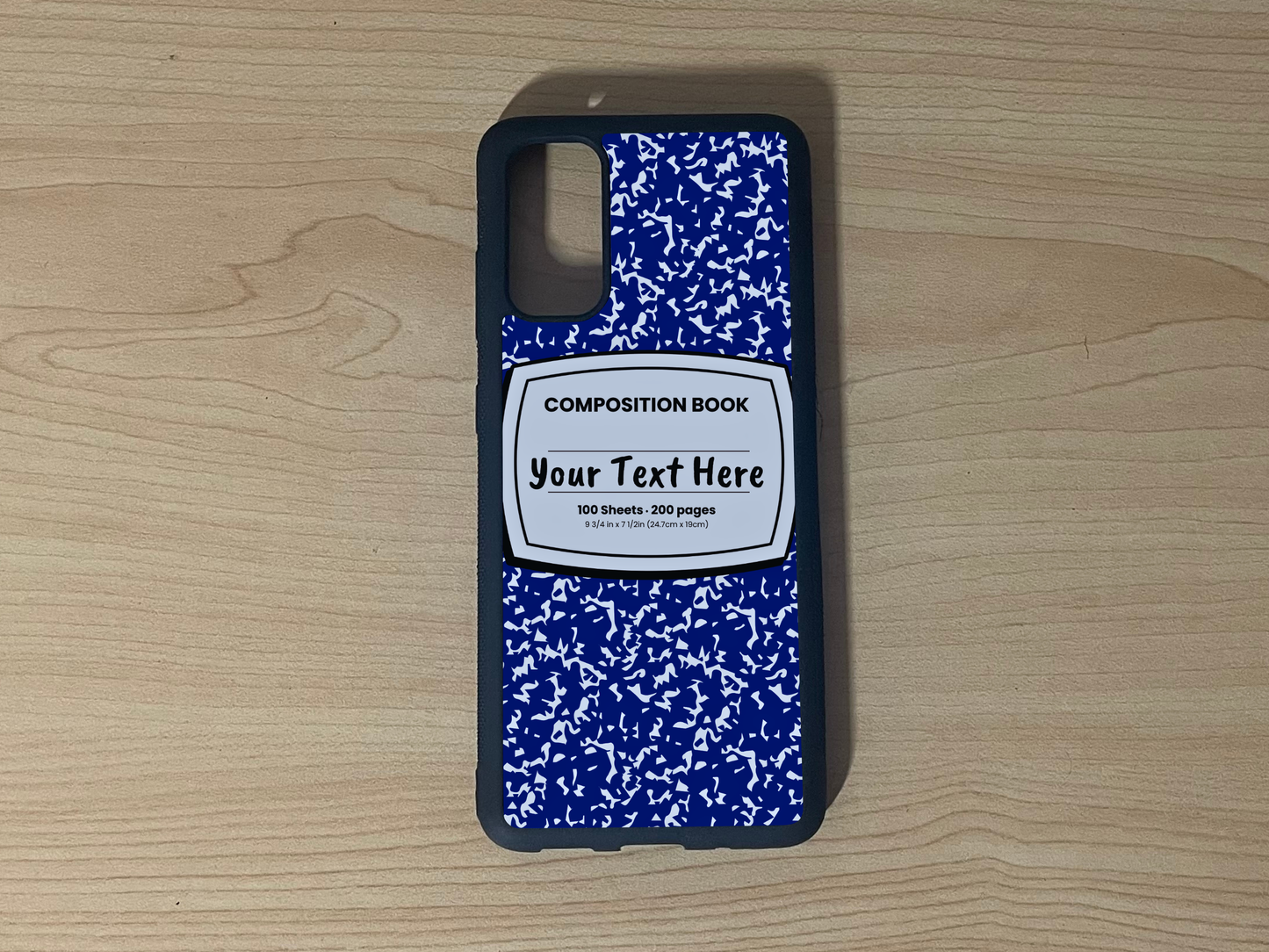 Custom phone case for the Samsung S20, S20 Ultra and S20 Fe with a blue and white composition notebook design with text "Your text here" on a wooden surface.