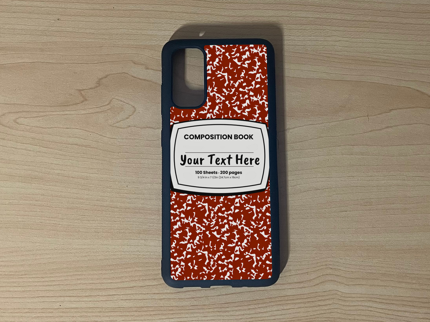 Custom phone case for the Samsung S10 and S10e with a red and white composition notebook design with text "Your text here" on a wooden surface.