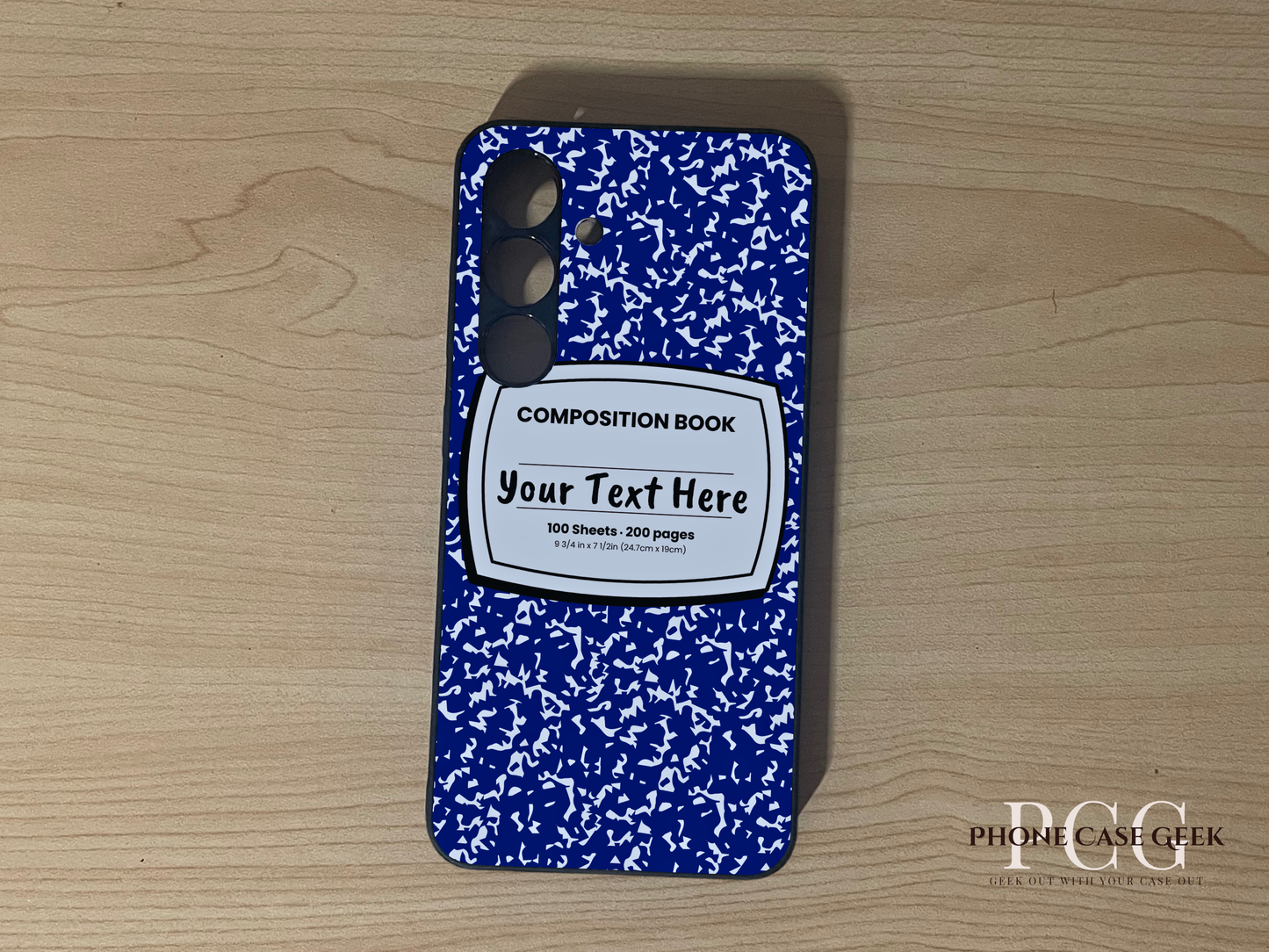 Custom phone case for the Samsung S24 and S24 Plus with a blue and white composition notebook design with text "Your text here" on a wooden surface.