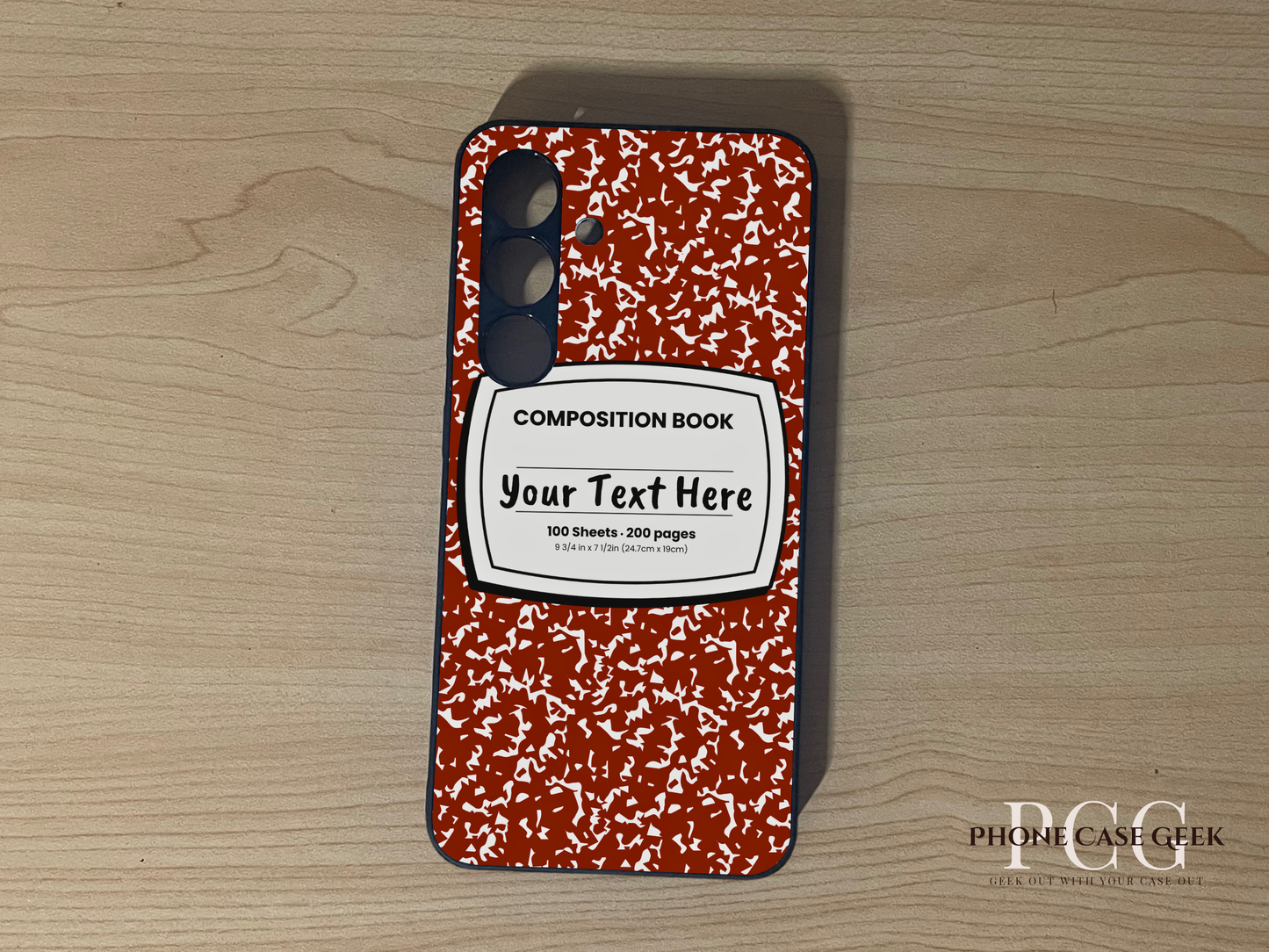 Custom phone case for the Samsung Note S24 and S24 Plus with a red and white composition notebook design with text "Your text here" on a wooden surface.