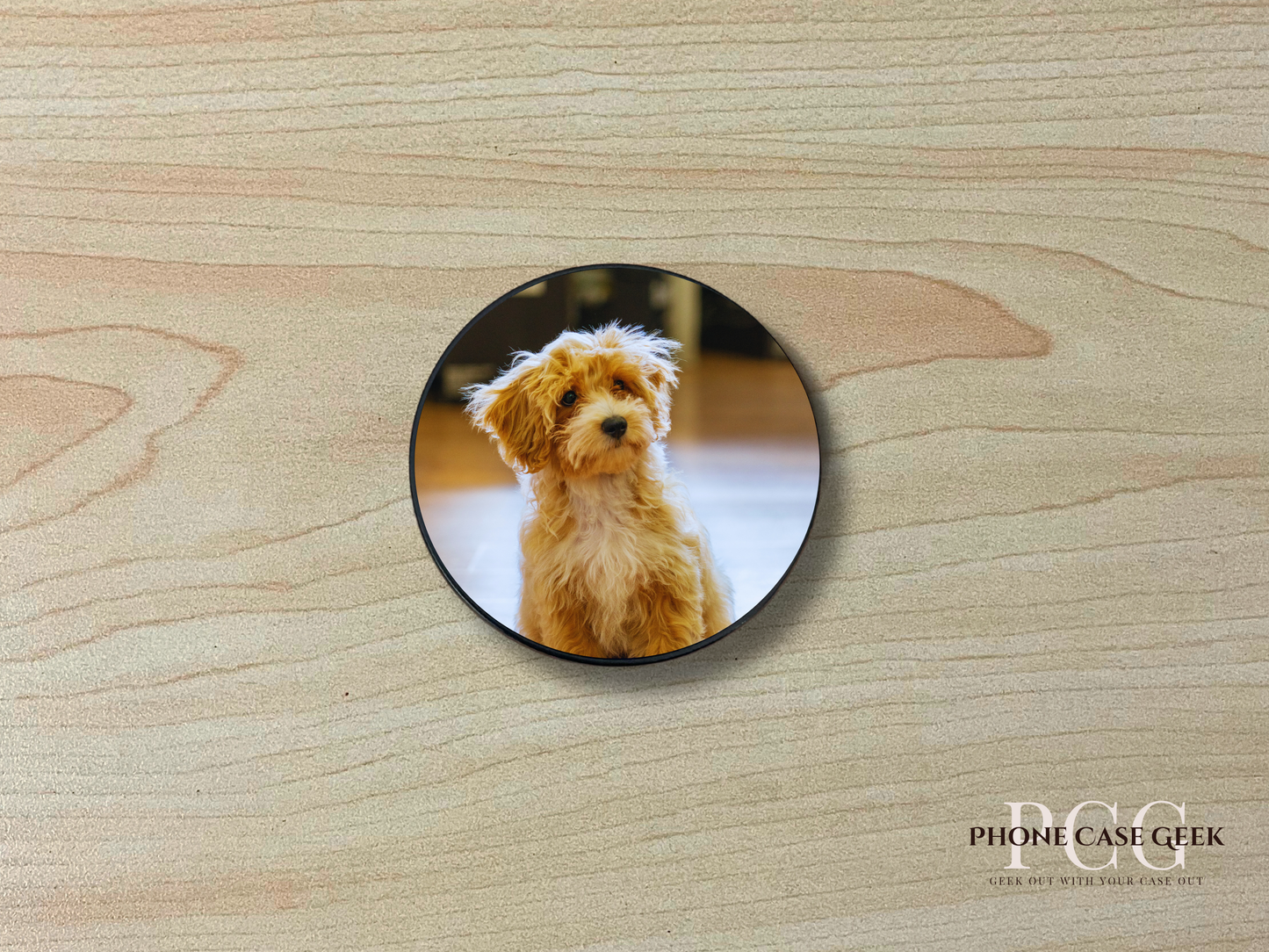 Custom adhesive phone grip with photo of a dog on a wooden surface.