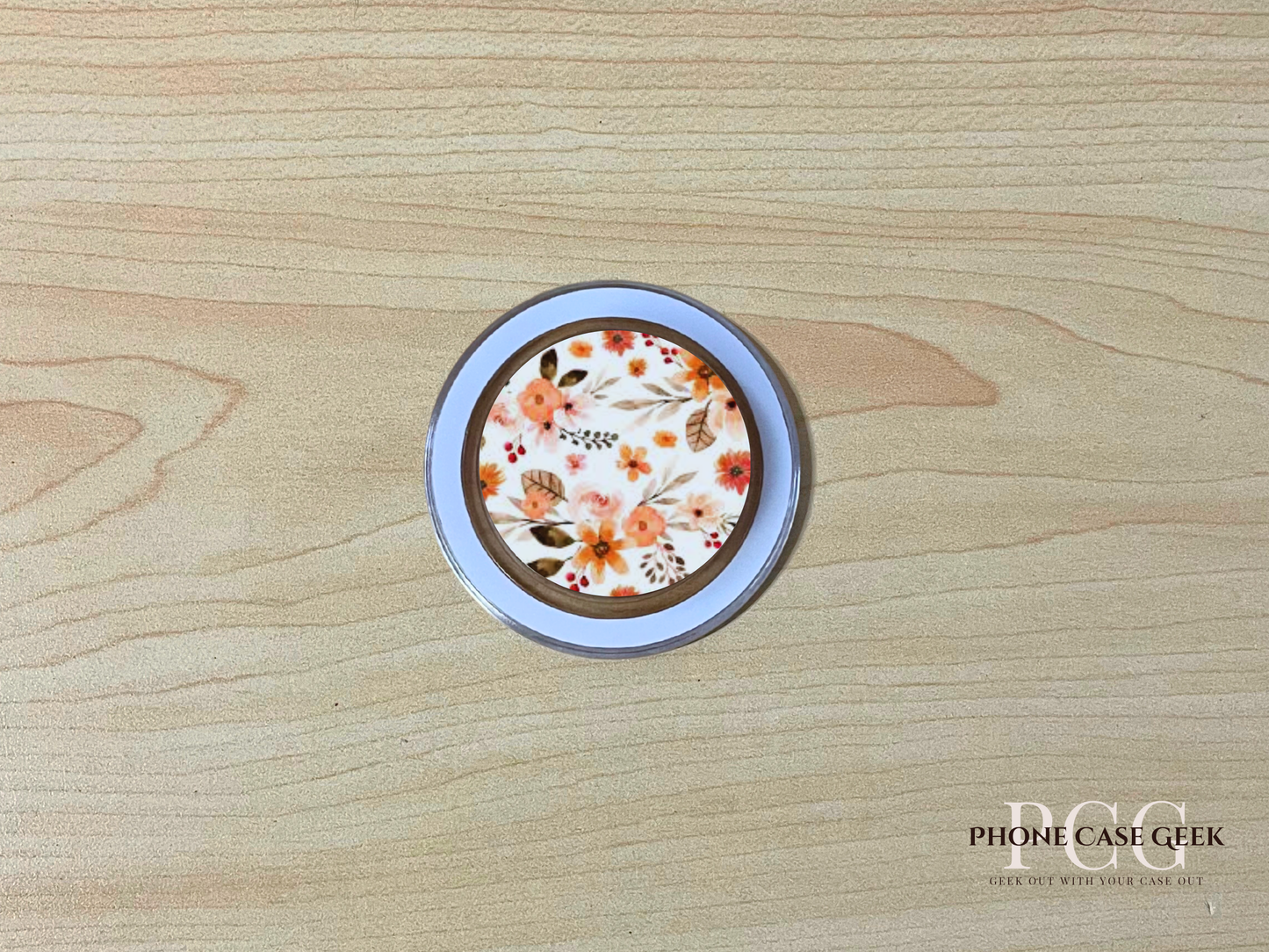Custom clear base Magsafe phone grip with photo of a floral on a wooden surface.