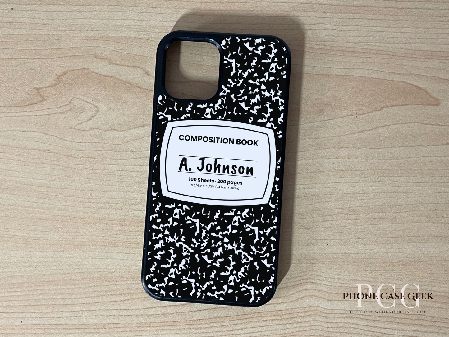 Custom iPhone case with black and white composition book design with "A. Johnson" written on a wooden surface