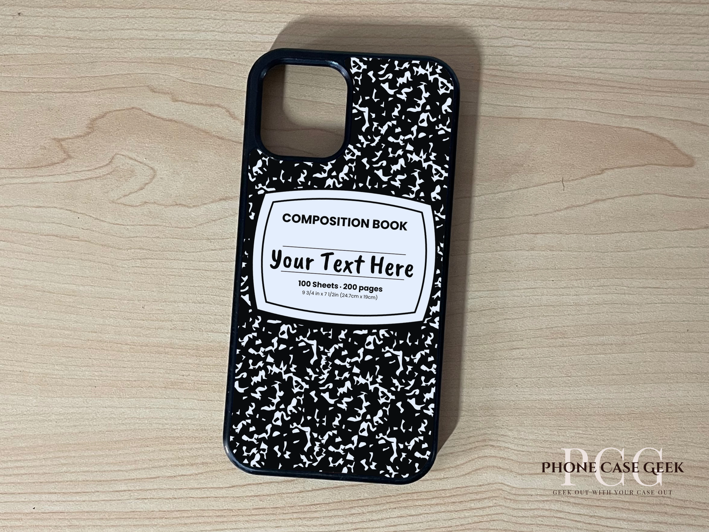 Custom iPhone case with black and white composition book design with "Your text here" written on a wooden surface
