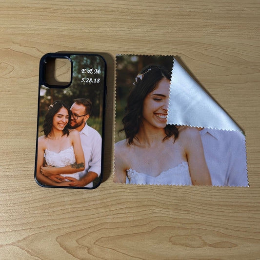 Custom iPhone case with couples photo design matching microfiber cloth phone screen cleaner on a wooden surface.