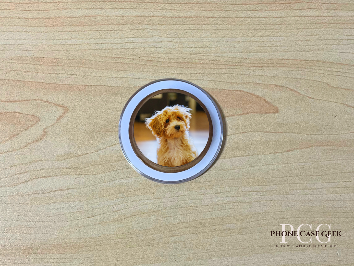 Custom clear case Magsafe phone grip with photo of a dog on a wooden surface.