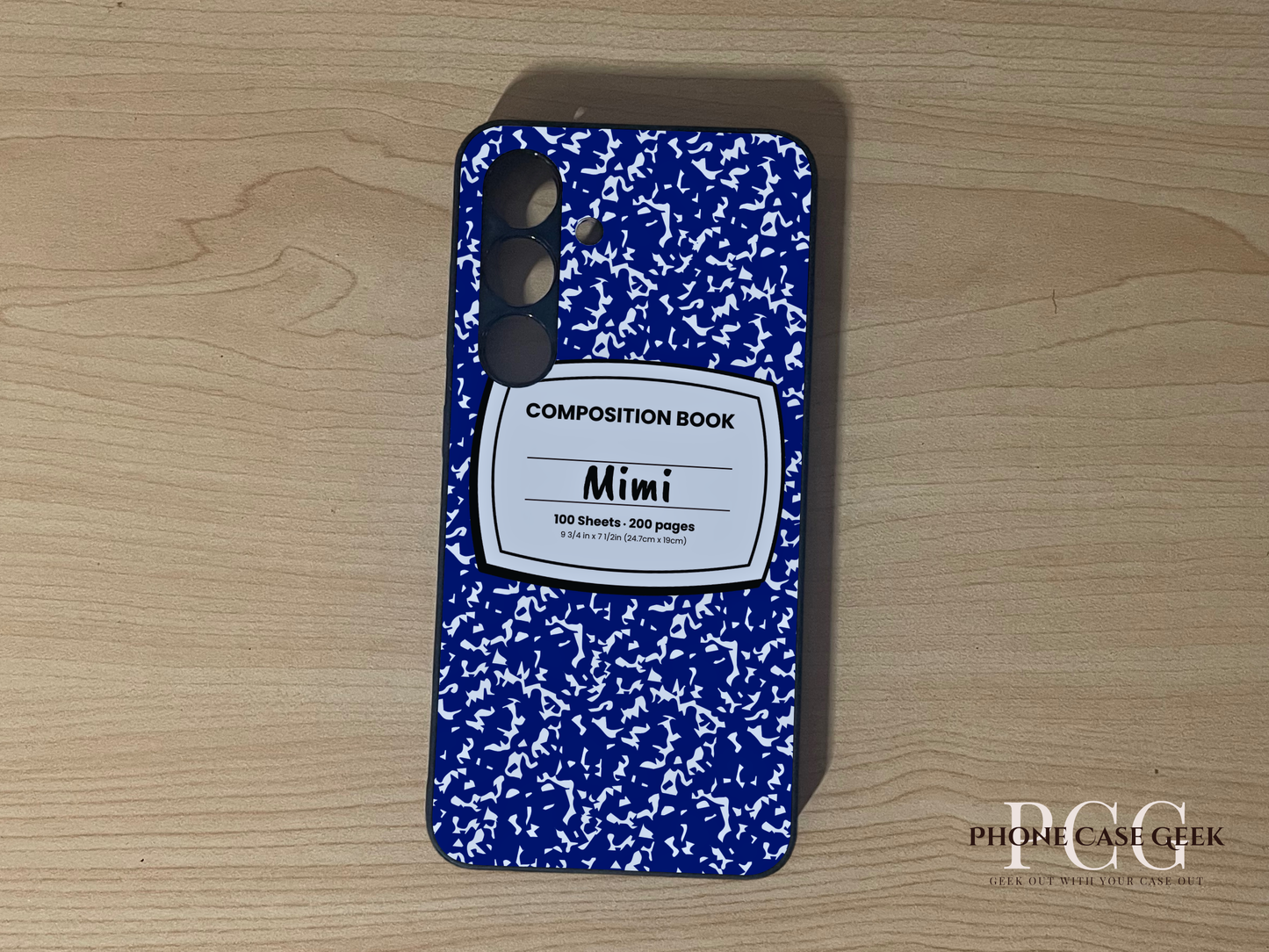 Custom Samsung S24 and S24 Plus case with blue and white composition book design with "Mimi" written on a wooden surface