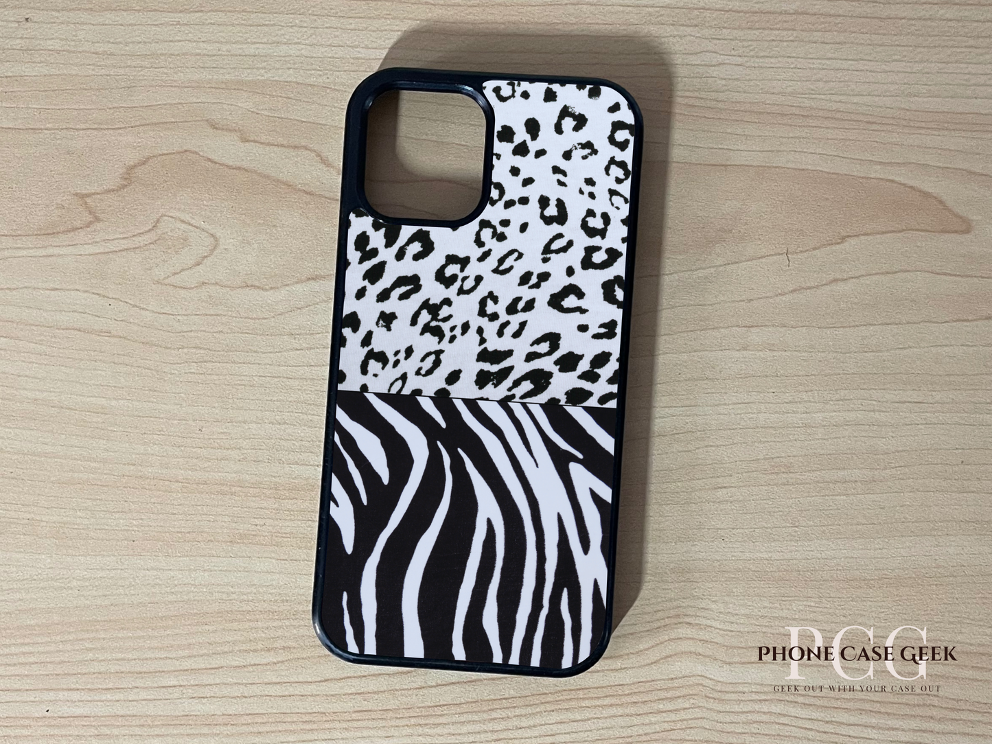 Custom iPhone case with 2 photo collage of black and white animal print pattern on a wooden surface