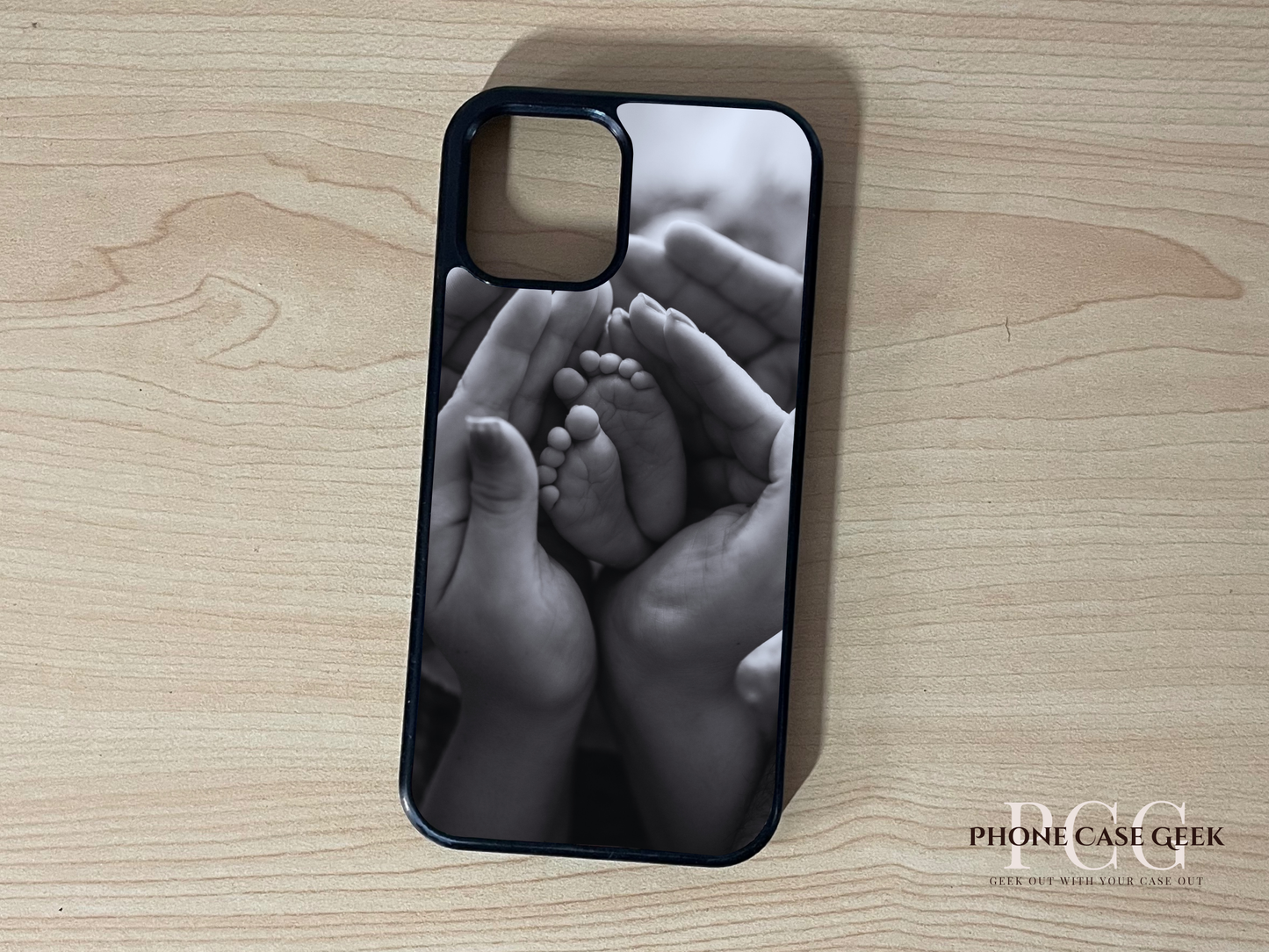 Custom iPhone case of photo of with hands holding baby feet design on a wooden surface