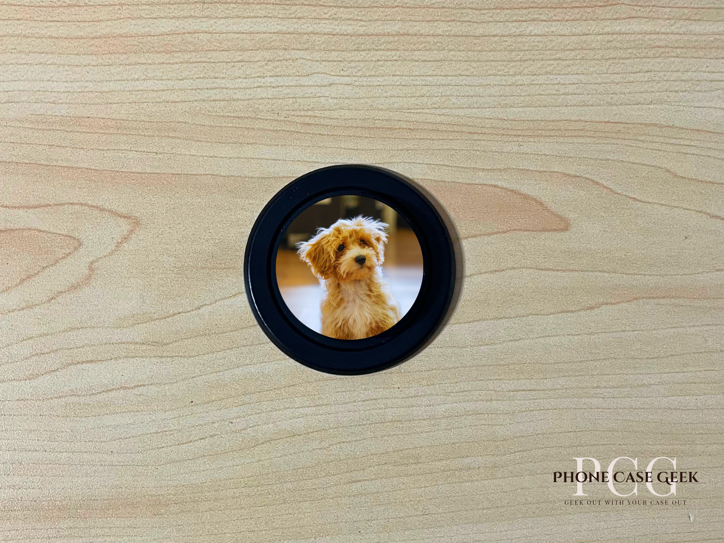 Custom black base Magsafe phone grip with photo of a couple on a wooden surface.