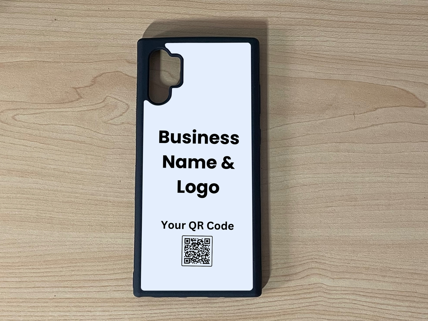 Custom phone case for the Samsung Note 10 Plus showing placement for business logo design and customizable QR code on a wooden surface