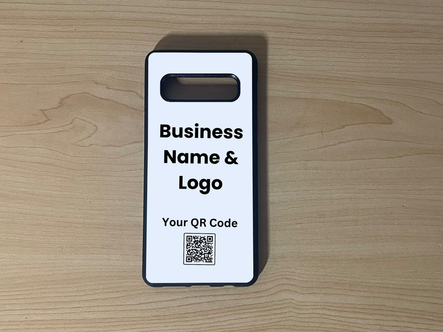 Custom phone case for the Samsung S10 and S10e showing placement for business logo design and customizable QR code on a wooden surface
