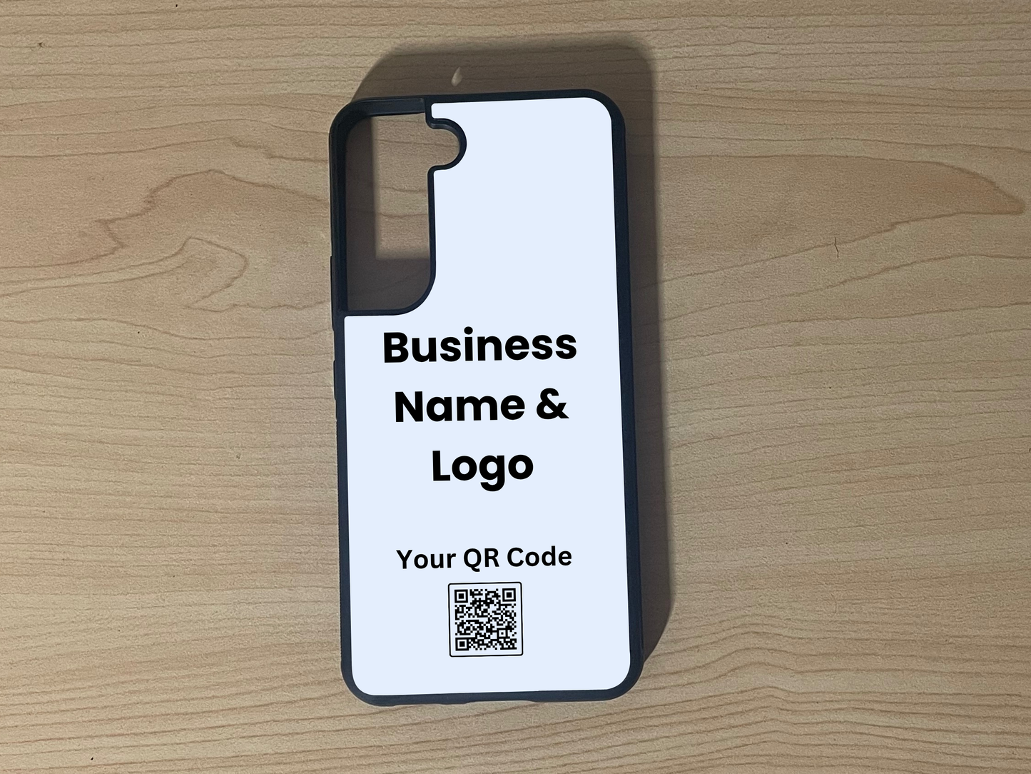 Custom phone case for the Samsung S21 and S21 Plus showing placement for business logo design and customizable QR code on a wooden surface