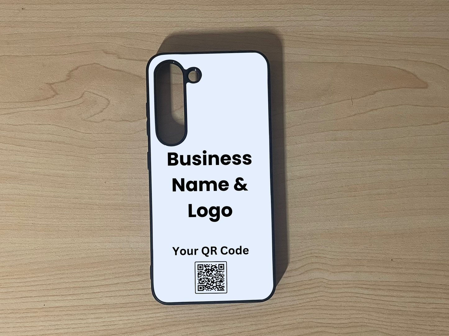 Custom phone case for the Samsung S23 and S23 Plus showing placement for business logo design and customizable QR code on a wooden surface