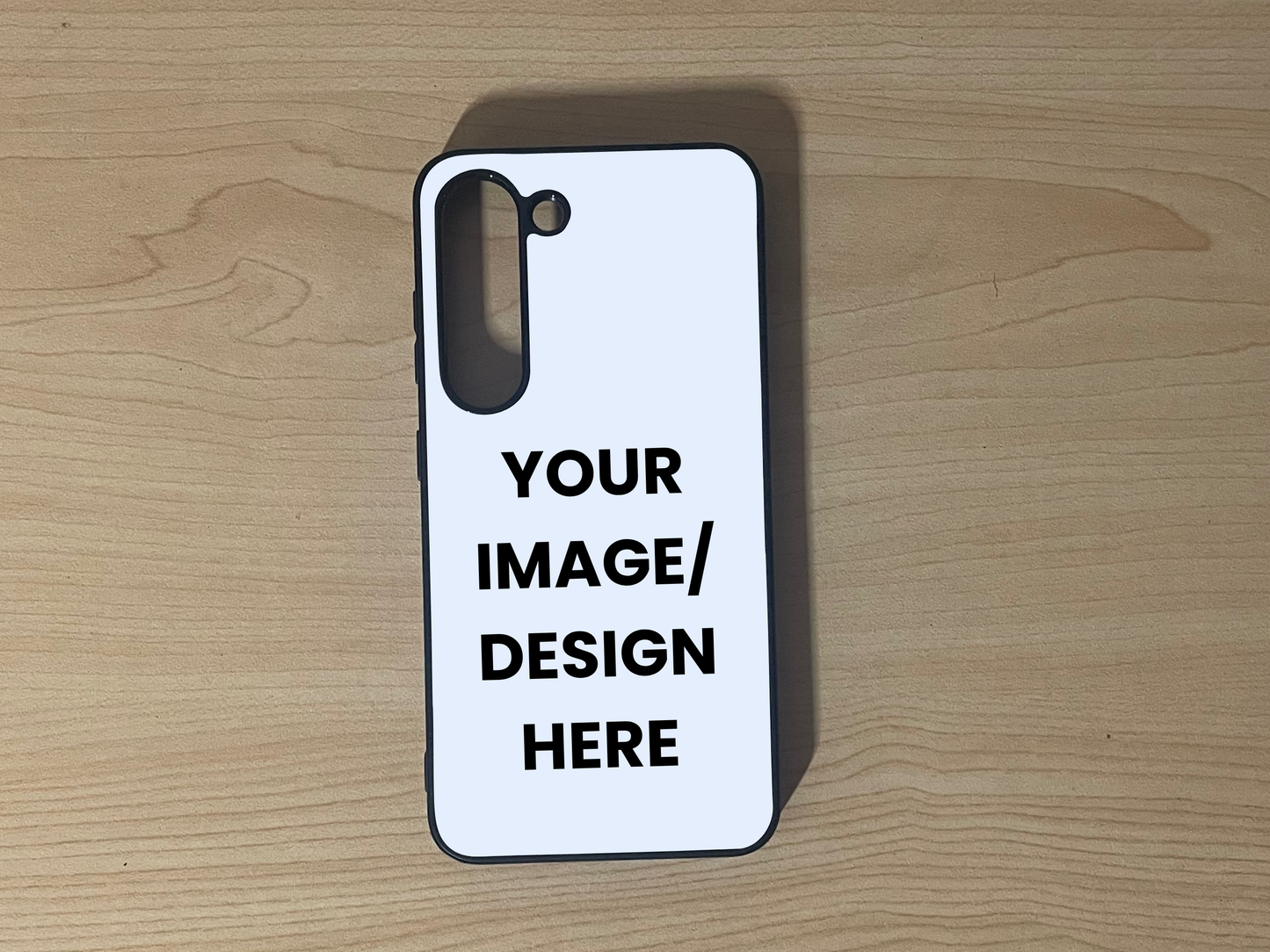Custom phone case for Samsung S23 and S23 Plus with 'Your Image/Design Here' text on a wooden surface to show customization.