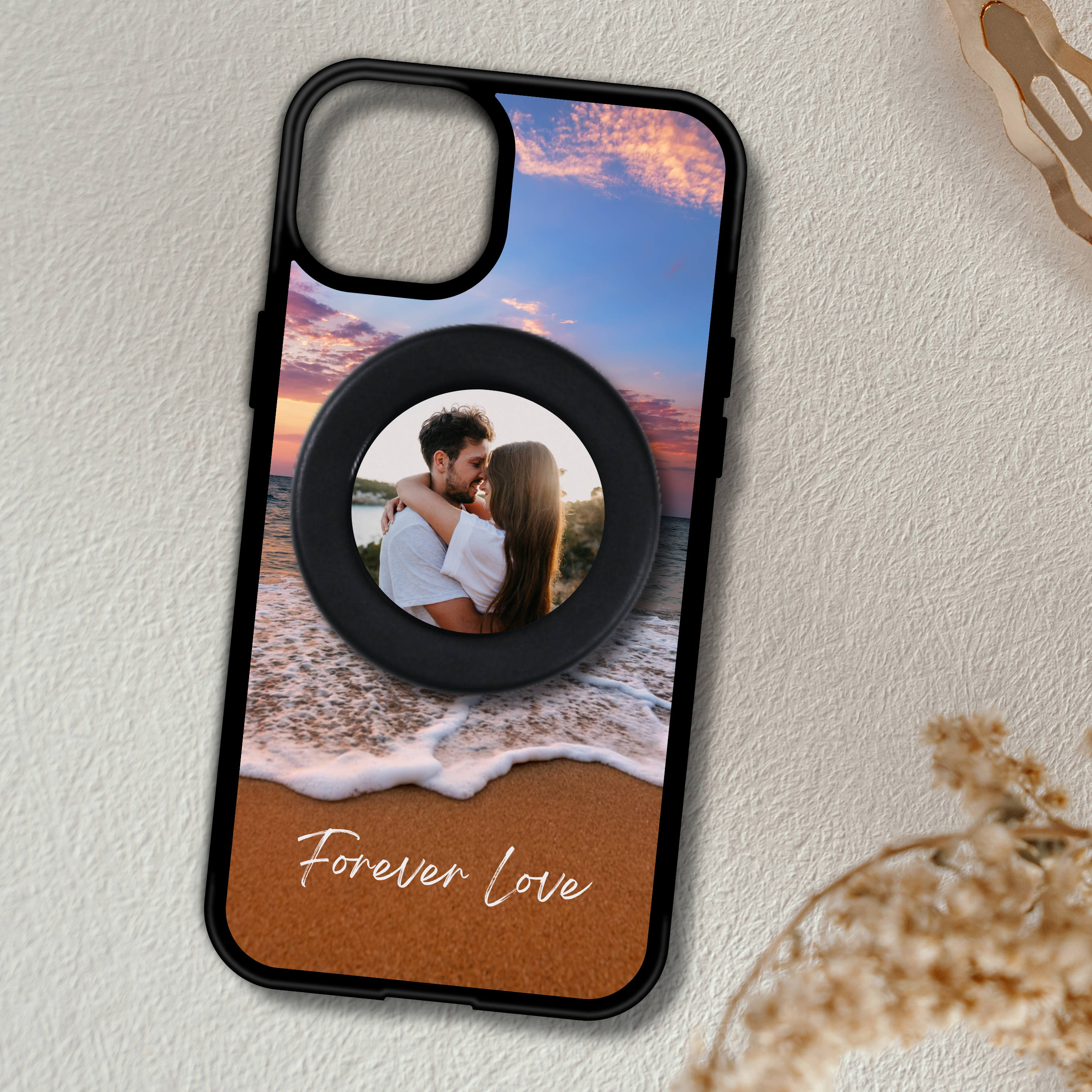 Phone case with a beach scene and 'Forever Love' text on a textured surface with a MagSafe phone grip with custom photo.