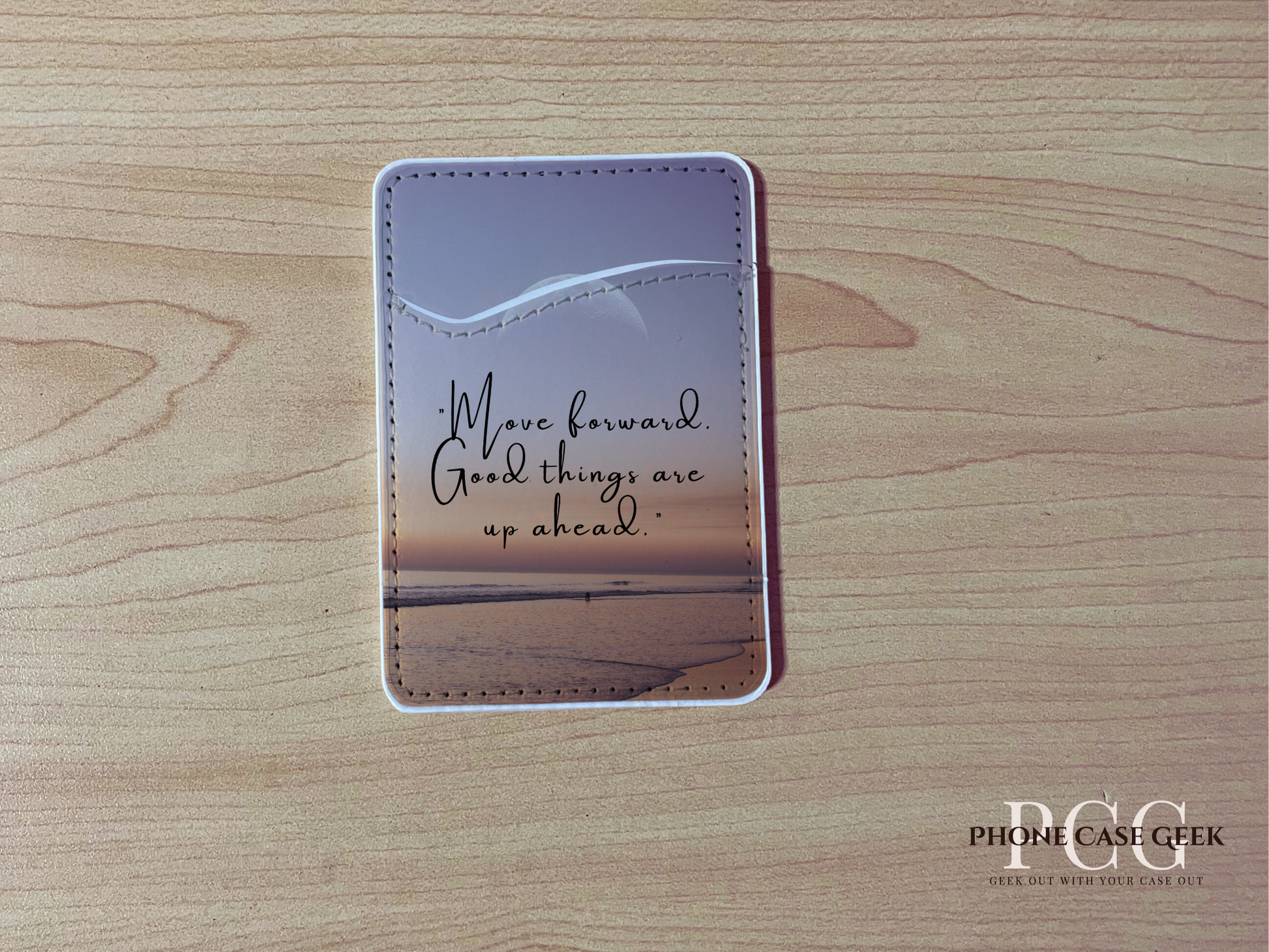 Custom phone wallet/card holder with beach image with quote design "Move forward good things are up ahead" text on a wooden surface.