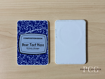 Custom Magsafe phone wallet/card holder with blue and white composition notebook design on a wooden surface.