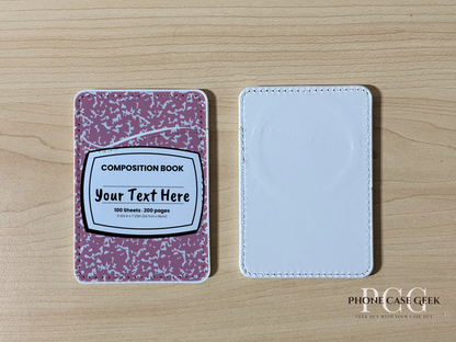 Custom Magsafe phone wallet/card holder with pink and white composition notebook design on a wooden surface.