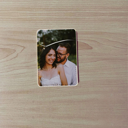 Custom phone card holder / wallet with a printed design of a couple on a wooden surface.