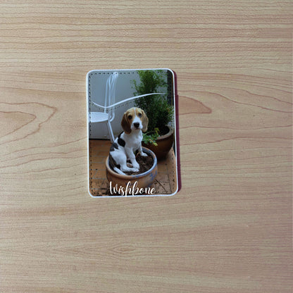 Custom phone wallet/card holder with a picture of a dog with "Wishbone" text on a wooden surface.