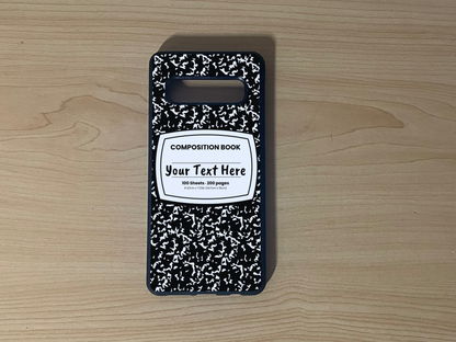Custom phone case for the Samsung S10 and S10e with a black and white composition notebook design with text "Your text here" on a wooden surface.