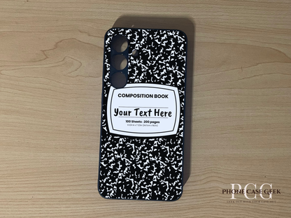 Custom phone case for the Samsung S24 and S24 Plus with a black and white composition notebook design with text "Your text here" on a wooden surface.