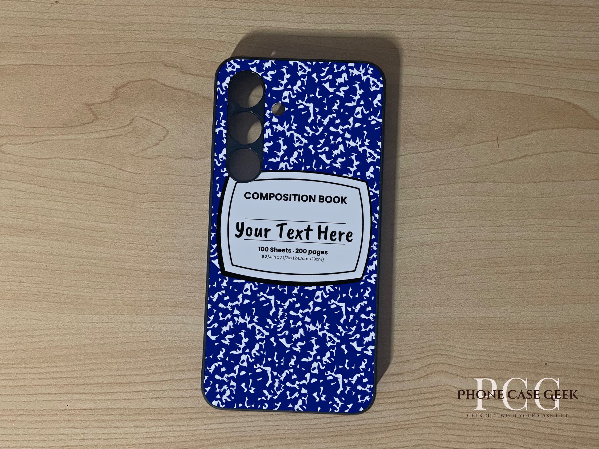 Custom phone case for the Samsung S24 and S24 Plus with a blue and white composition notebook design with text "Your text here" on a wooden surface.