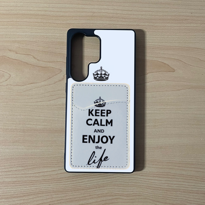 Custom phone case with 'Keep Calm and Enjoy the Life' text with matching phone wallet/card holder on a wooden surface