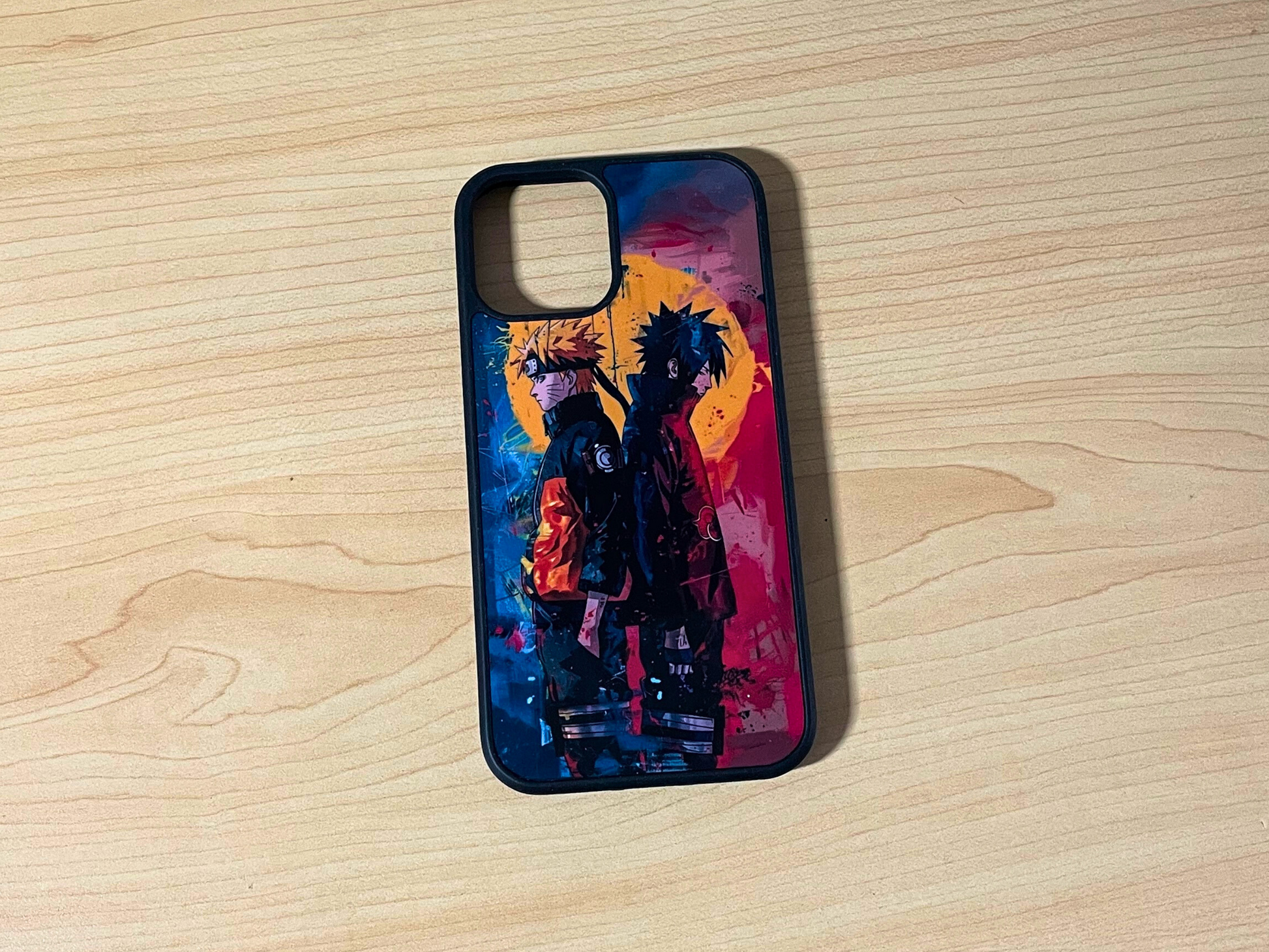 Phone case with a colorful design on a wooden surface