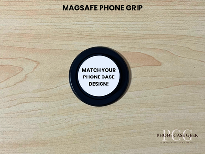 Custom black base Magsafe phone grip on a wooden surface with text "Match your phone case design" on a wooden surface.