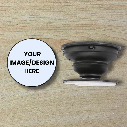 Custom phone grip showing top and side view and text saying "Your image/design here" on a wood background