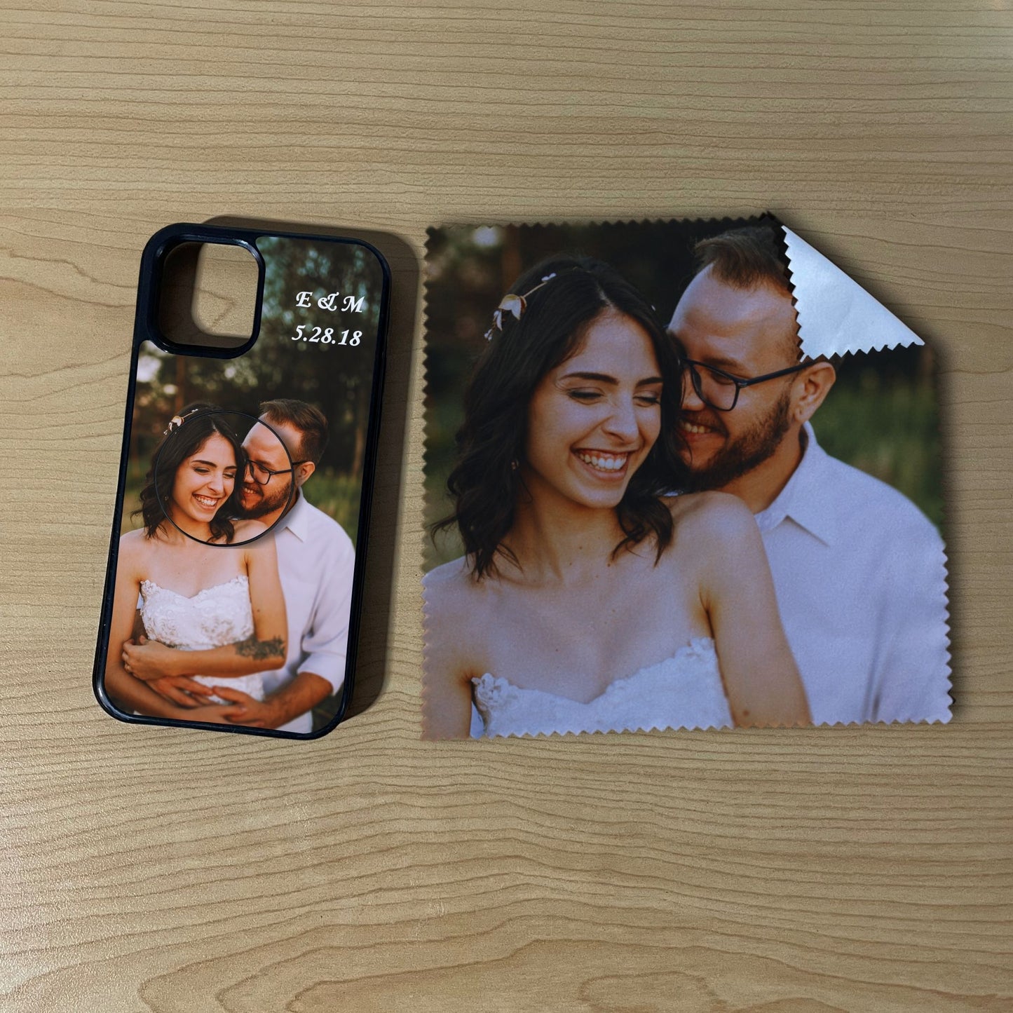 Custom iPhone case with a couple's photo with matching phone grip and matching microfiber cloth phone screen cleaner on a wooden surface
