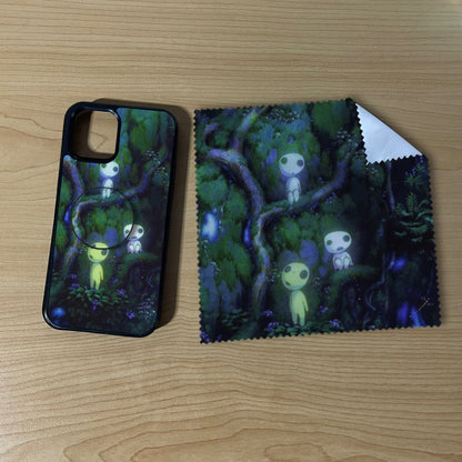 Custom iPhone case bundle set with a phone grip and cleaning cloth with matching forest design on a wooden surface.