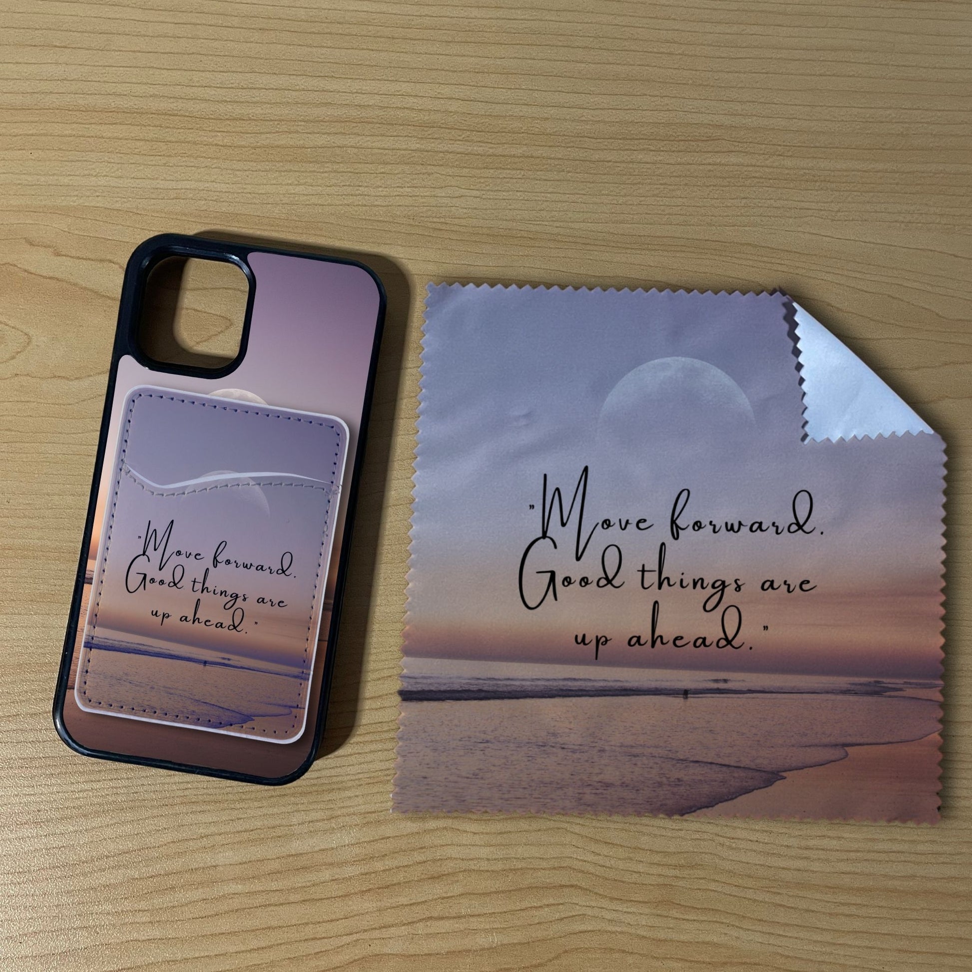 Custom iPhone case with a beach design with matching phone wallet card holder and matching microfiber cloth phone screen cleaner on a wooden surface