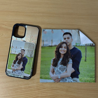 Custom iPhone case with a couple's photo with matching phone wallet card holder and matching microfiber cloth phone screen cleaner on a wooden surface