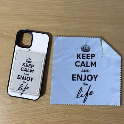 Custom iPhone case with text "Keep calm and enjoy the life" with matching phone wallet card holder and matching microfiber cloth phone screen cleaner on a wooden surface