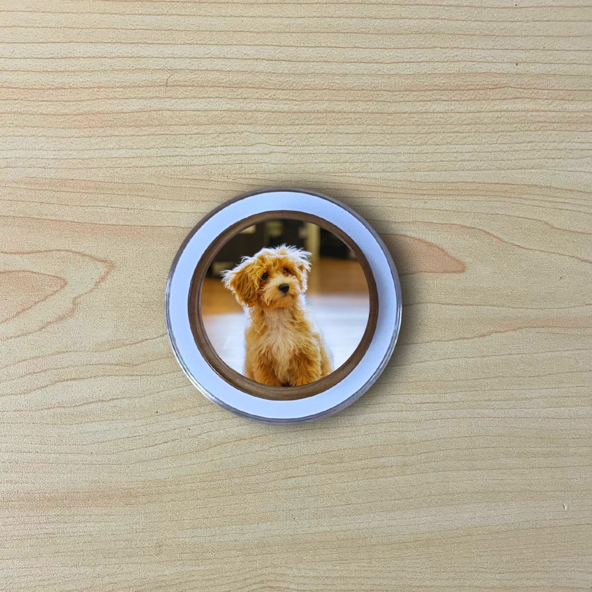 Custom clear case Magsafe phone grip with photo of a dog on a wooden surface.
