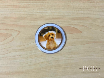 Custom clear case Magsafe phone grip with photo of a dog on a wooden surface.