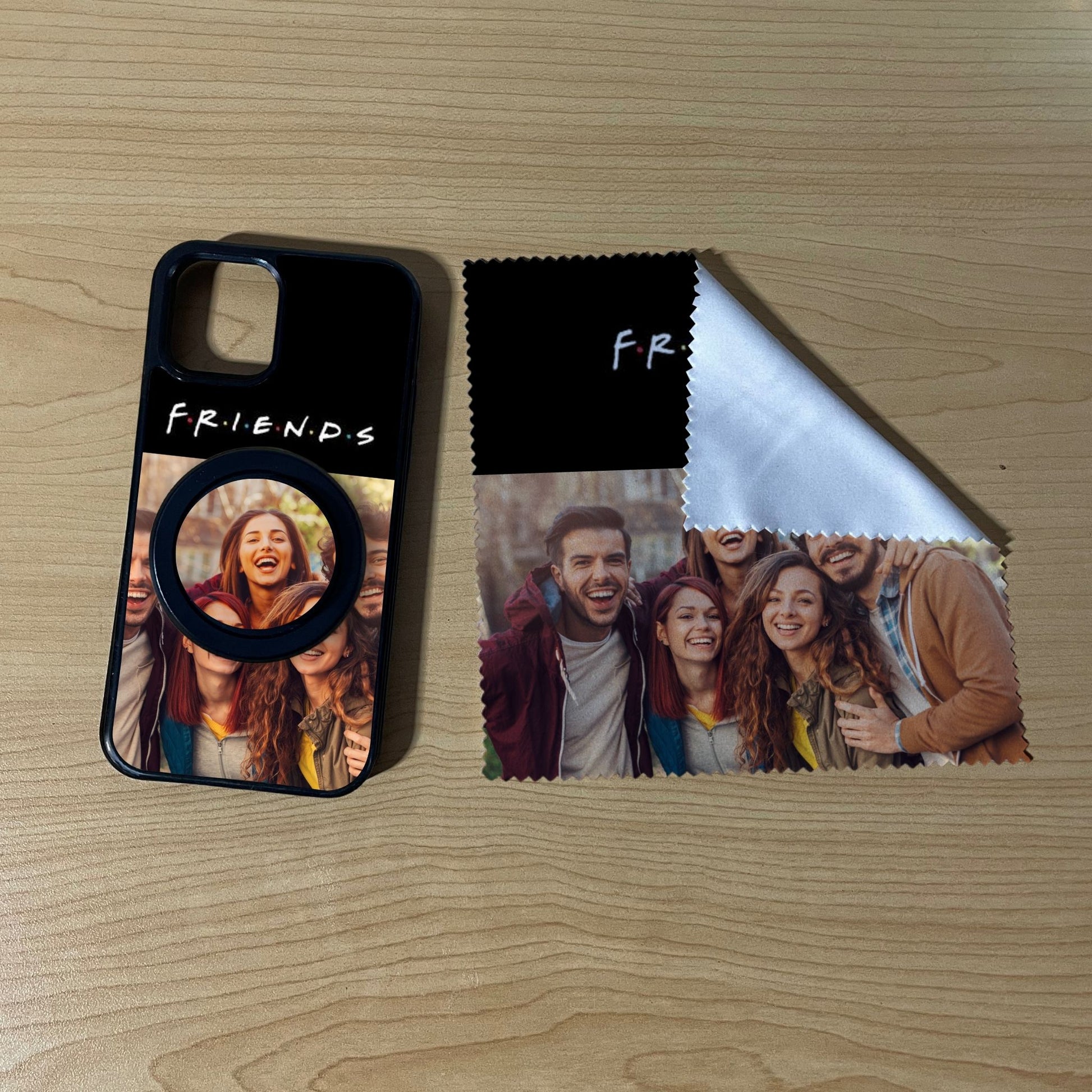 iPhone matching MagSafe bundle set with a phone case, phone grip and microfiber cloth with 2 photo collage friends theme on a wooden surface