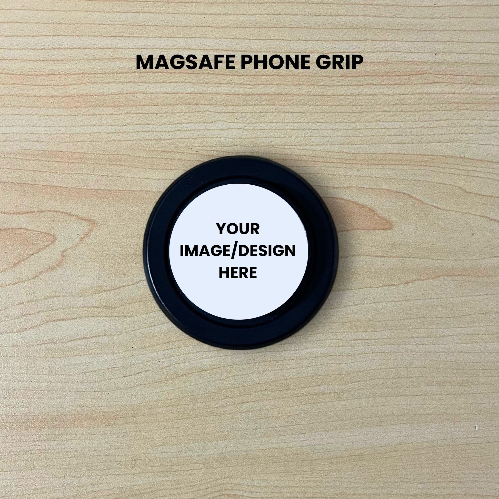Black base Magsafe phone grip mockup on a wooden surface with customizable area.