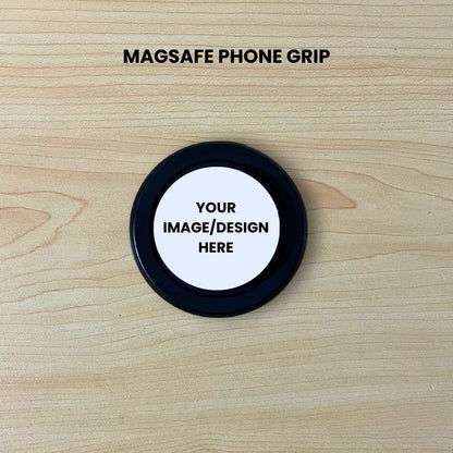 Black base Magsafe phone grip mockup on a wooden surface with customizable area.
