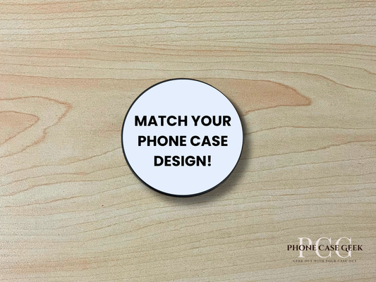 Custom adhesive phone grip with text "Match your phone case design" showing placement on a wooden surface.