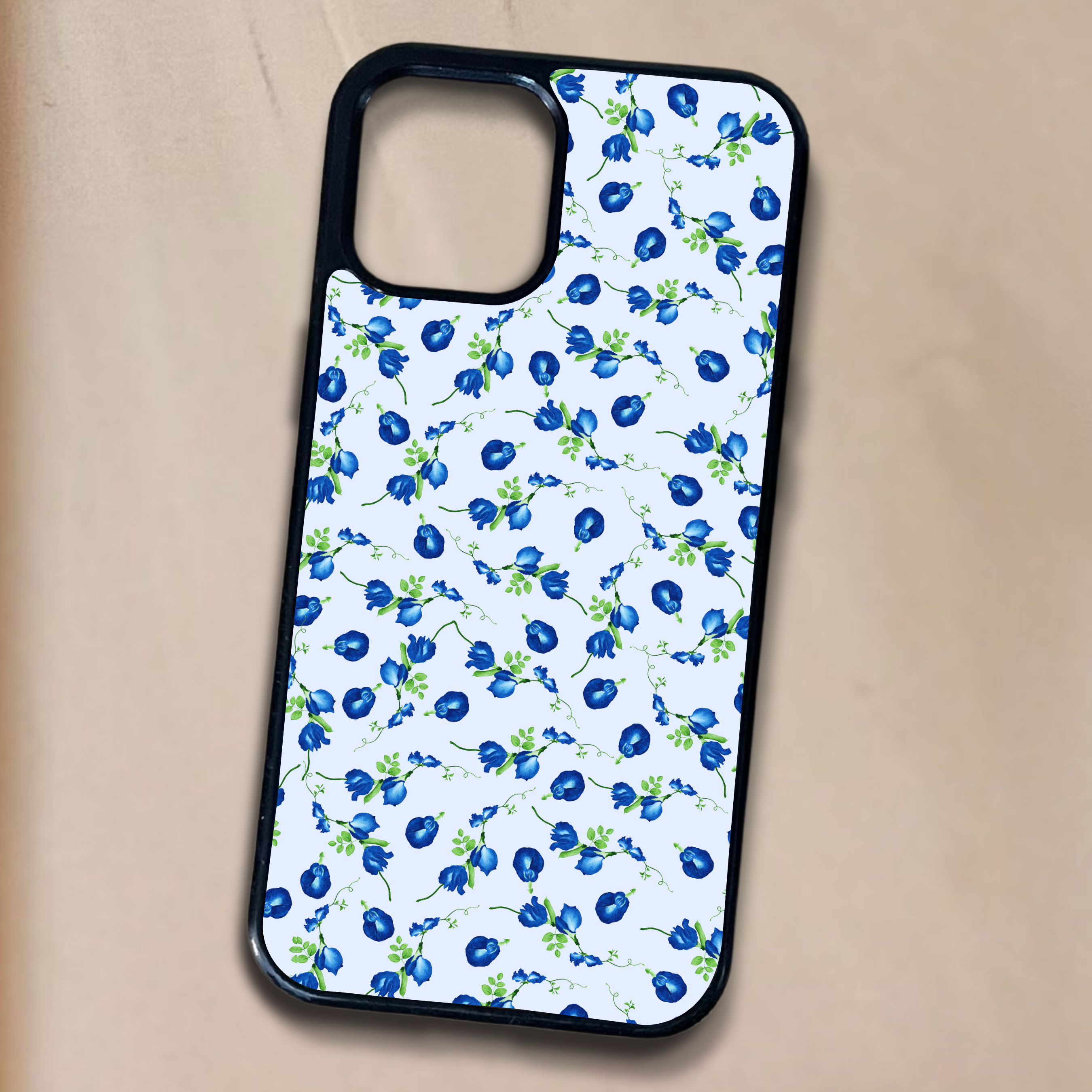 Phone case with blue floral pattern on a beige background
