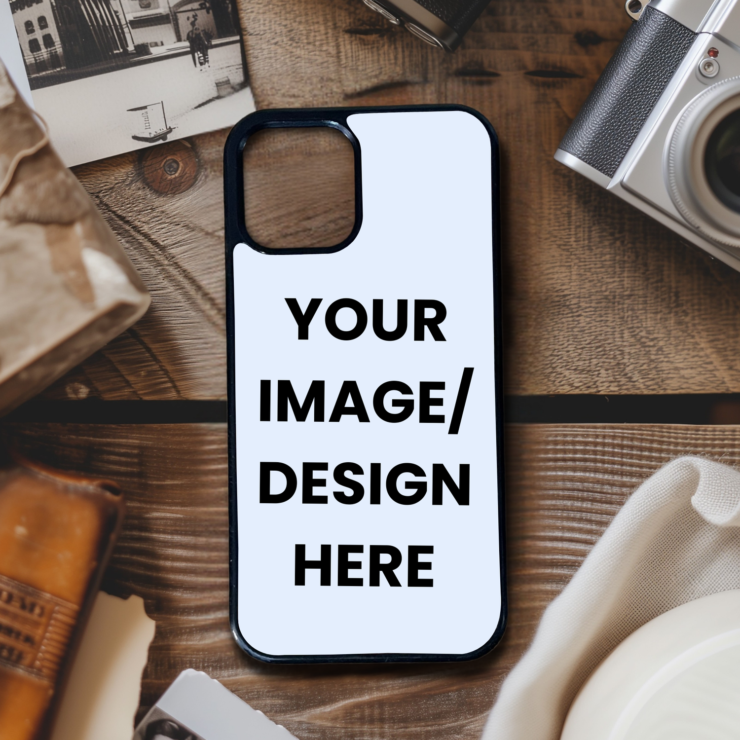 Phone case with customizable text on a wooden surface with vintage items