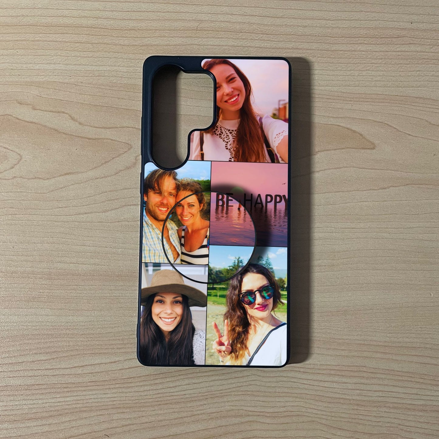 Custom Samsung phone case with 5 photo couple theme collage with an attached phone grip on a wooden surface